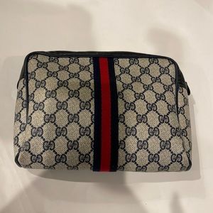 Gucci Authentic Toiletry/ Make up Bag in EUC some masks inside.